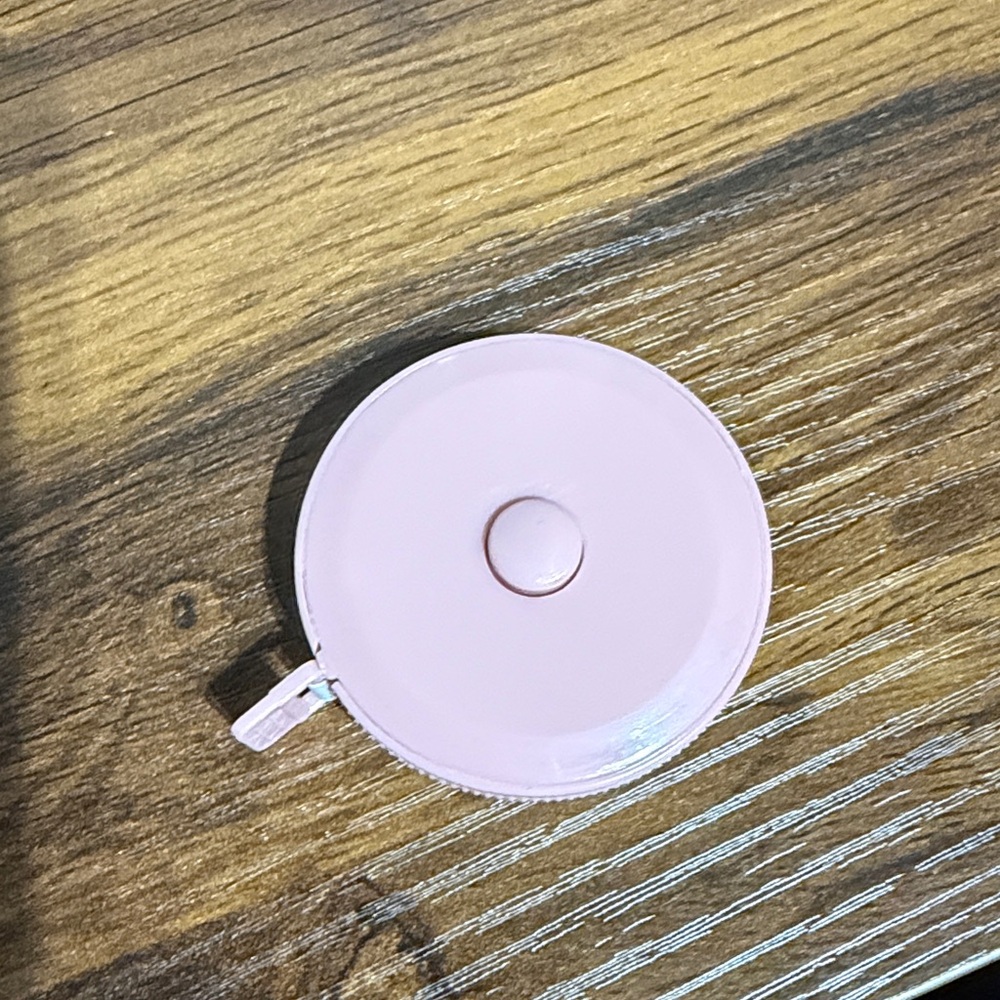 Compact Measuring Tape, Pulls Out, and Stays Push Button To Reel In!